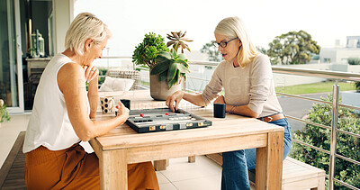 Buy stock photo Board game, relax and strategy with senior friends on home balcony together for bonding or concentration. Backgammon, playing and thinking with mature people outdoor at apartment for competition