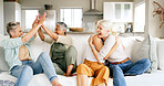 Friends, high five and support with old women on sofa in home for bonding, good news or retirement. Happiness, love and social reunion with group of senior people in living room of apartment for chat