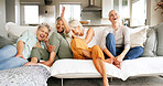 Elderly, happy women or watching tv with laugh on sofa for funny joke, comedy movie or show in home. Senior, female person or group of friends with smile for humor, series or entertainment in house