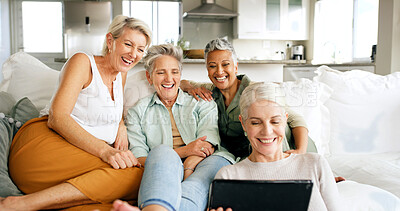 Buy stock photo Sofa, mature women and laughing with tablet in home for comedy show, weekend break and bonding. Relax, friend group and happy with tech in apartment for streaming funny movie, holiday reunion or care