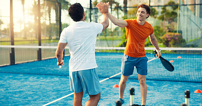 Buy stock photo Padel, coach and men on court high five for training, practice and exercise for challenge success. Fitness, personal trainer and people celebrate for game, tennis match and competition outdoor