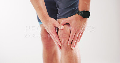 Buy stock photo Fitness, knee pain and accident with man in studio for workout injury, inflammation or fibromyalgia. Exercise mistake, training burnout and leg sprain with person on white background for tension
