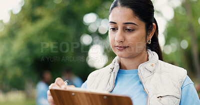 Buy stock photo Woman, volunteer or clipboard with checklist for charity campaign or eco friendly development in park. Female person, activist or NGO with to do list, stock or inventory for community donation
