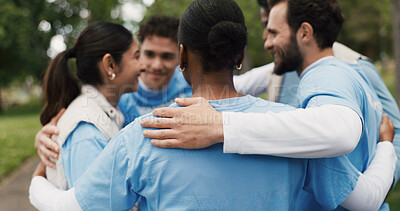 Buy stock photo Volunteer, group in circle or huddle outdoor for community service, NGO and help for social responsibility. Back support, team and people with motivation for nonprofit charity and activism in park 