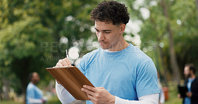 Buy stock photo Man, volunteer or writing with clipboard for donation checklist, campaign or outreach in nature. Male person, activist or NGO society with list for community service, charity organization or change