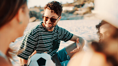 Buy stock photo Outdoor, vacation and man with friends, talking and bonding on break, laugh or discussion with group. Happy, people and conversation on summer holiday, getaway and together in nature, trip and beach