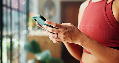 Buy stock photo Woman, hands and typing with phone for health tips, workout routine or fitness guide in home. Closeup, female person or texting with mobile smartphone for online app or exercise schedule in house