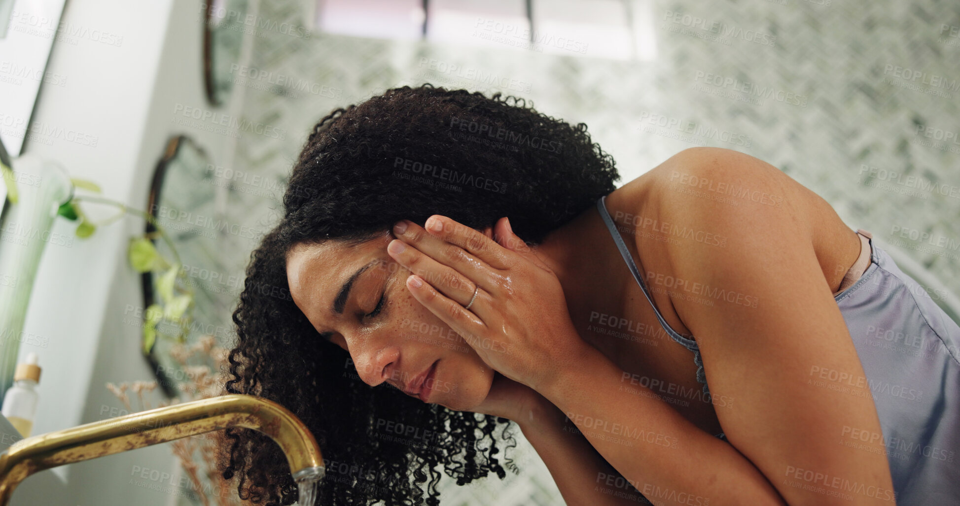 Buy stock photo Bathroom, self care and woman washing face by faucet, hygiene and grooming routine for morning wellness. Skincare, facial cleansing or person in home for dermatology practice, tap water and low angle