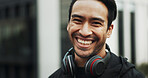 Fitness portrait, man and smile in city for exercise break, wellness progress and cardio training. Space, happy athlete and headphones outdoor for workout rest, running practice and pace improvement