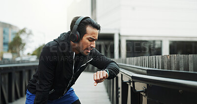 Buy stock photo Break, athlete and check watch with running in city for workout progress, performance monitor or track speed. Runner, man and challenge for training, fitness and exercise for endurance or wellness