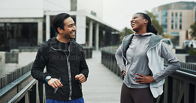 Buy stock photo Runner, people and break with laugh in city for fitness, race training or teamwork. Interracial couple, bonding and funny joke for workout, cardio and exercise for sport challenge or endurance