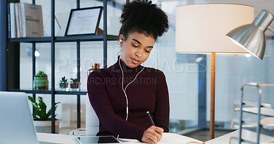 Buy stock photo Earphones, planning and writing with business woman at desk in office for agenda or schedule. Music, notebook and technology with employee person in workplace for appointment or calendar management