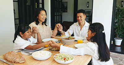 Buy stock photo Family, holding hands and praying in home with food for gratitude, religious belief or lunch together. Thankful, parents and kids with prayer in dining room for meal, nutrition or spiritual blessing.