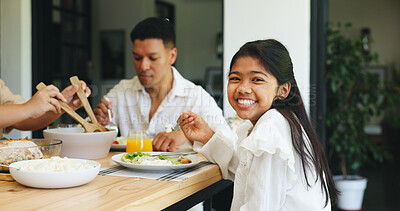 Buy stock photo Portrait, girl eating and family in home with food for healthy nutrition, lunch and bonding together. Happy, child and parents at dining table with plate for meal, cuisine and connection in house.