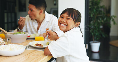 Buy stock photo Portrait, girl eating and family lunch in home with food for healthy nutrition, cuisine and bonding. Happy, child and parent at dining table with plate for homemade meal, dish and wellness in house.