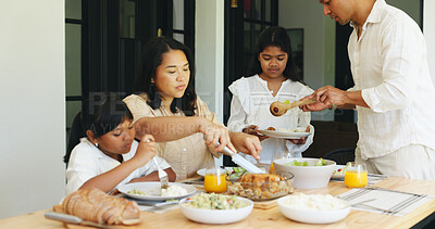 Buy stock photo Family dinner, children and woman cutting in dining room, holiday weekend and serving food for meal time. Hungry, parents and girls at table in home for healthy supper, eating together and bonding