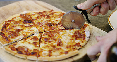 Buy stock photo Pizza, slicer and serve with hands on kitchen counter in home for eating lunch, nutrition and catering order. Meal prep, cheese and cooking with person and wooden board in apartment for food and dish