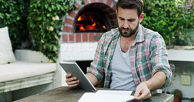 Buy stock photo Man, finance or documents with tablet for expenses, online bills or audit by fireplace. Male person, reading or checking with technology, paperwork or invoice for financial planning, budget or report