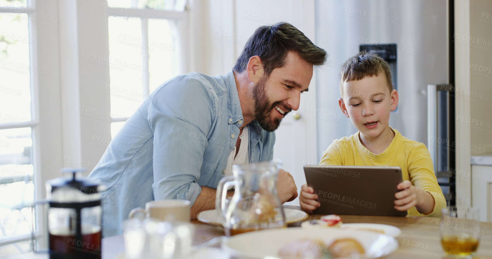 Buy stock photo Tablet, child and father in home with smile for app, bonding together and watch show with family. Boy, dad and tech in house for website, online movie or streaming cartoon with parent at breakfast