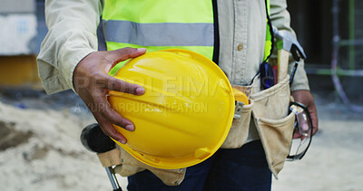 Buy stock photo Construction, outdoor and hands of man with helmet for infrastructure, building project and safety. Civil engineering, closeup and person with ppe for protection, architecture and renovation in city