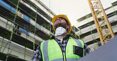 Buy stock photo Civil engineer, outdoor and man with blueprint, think and property development on construction site. Architect, reflection and person with renovation project, low angle and planning for architecture