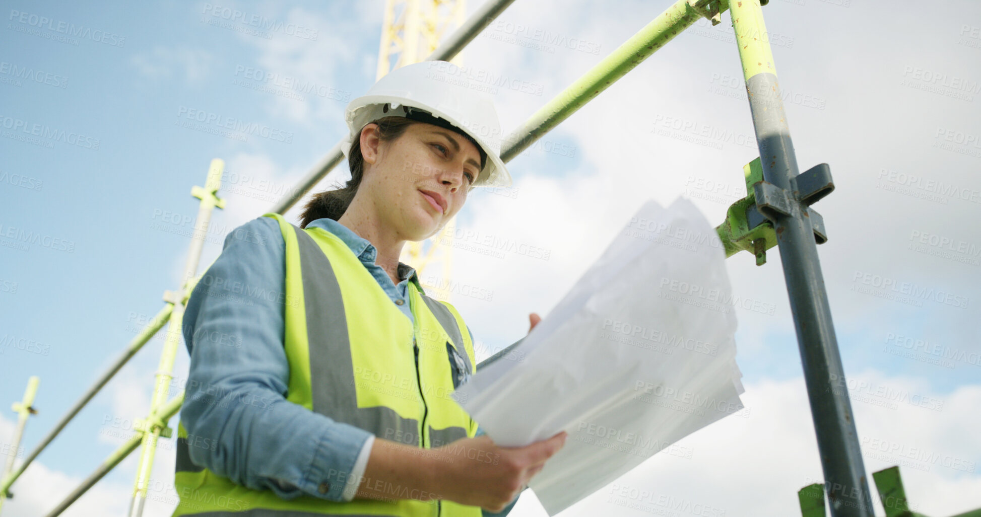 Buy stock photo Architect, outdoor and woman with documents, construction site and real estate renovation with info. Civil engineer, reading and person with blueprints, low angle or planning for property development