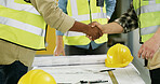 Architecture, blueprint and handshake for renovation project, building design and planning. People, scale and equipment shaking hands at construction site for floor plan, deal and development process
