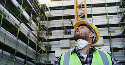 Buy stock photo Construction site, looking up and man with inspection, engineering and below with maintenance. Person, architecture project and employee in city, problem solving and helmet for safety and renovation