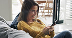 Happy woman, relax and scroll in home with phone, social media post and dating site notification. Person, smile and browsing on sofa with tech, text message and mobile app for online communication.