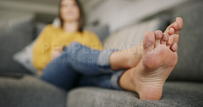 Buy stock photo Feet, woman and relax on couch at house for peace, calm morning and comfortable in living room. Toes, female person and rest on sofa for weekend break, unwind and chilling in lounge for stress relief