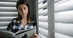 House, reading and woman with book, literature and relax with knowledge, education and hobby. Apartment, window and person with novel, story and learning with growth, creativity and development