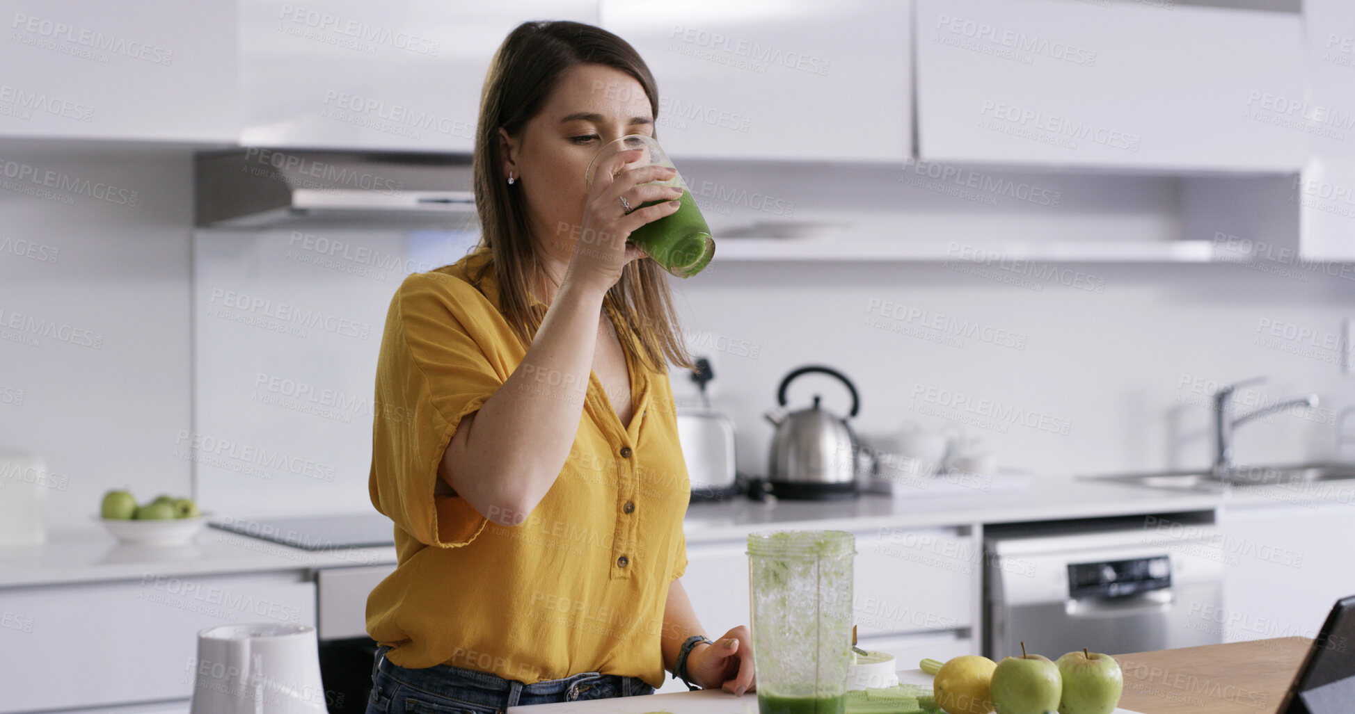 Buy stock photo Drink, woman and glass in home for breakfast, healthy diet and green fruit smoothie. Person, blender and technology in kitchen with shake for nutrition, weight loss and wellness or detox with brunch