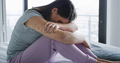Buy stock photo Sad, woman and stress on bed in house with emotional burnout, relationship mistake and mental health. Regret, person with depression and unhappy in bedroom with overthinking, broken heart or insomnia