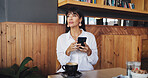 Business woman, phone and wait in coffee shop for break, social media and notification. Mature freelancer, research and tech with internet for meeting, website or review in cafe for project proposal