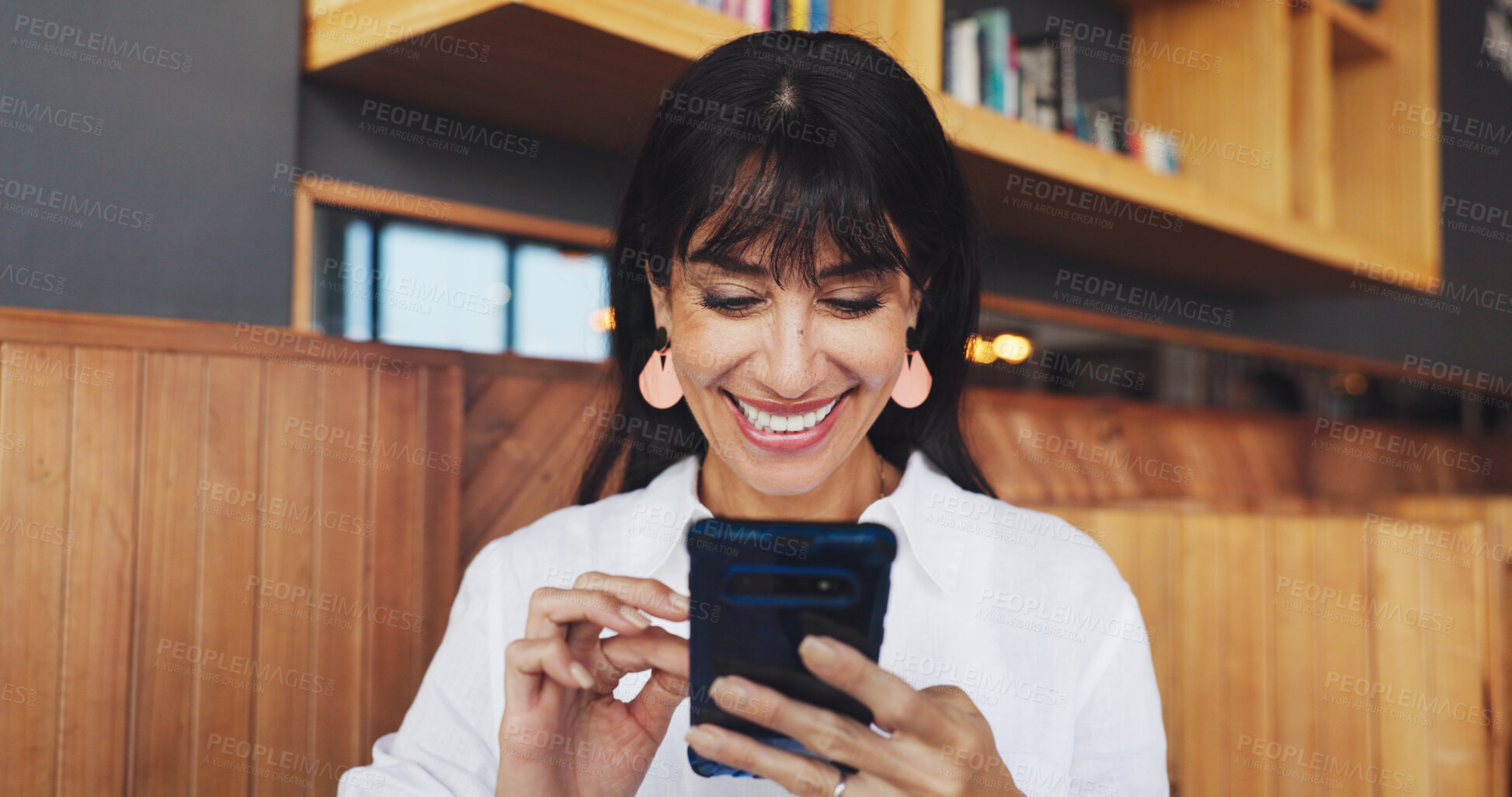 Buy stock photo Business woman, phone and smile in coffee shop for break, social media or remote work. Mature freelancer, research and tech with internet for feedback, website or review in cafe for notification