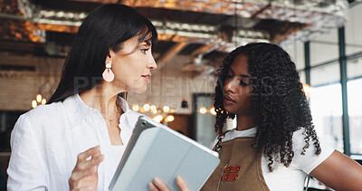 Buy stock photo Cafe owner, waitress and meeting with tablet for online inventory checklist, staff schedule or review supplier info. Women, barista and boss on tech for menu planning, coffee shop agenda or budget