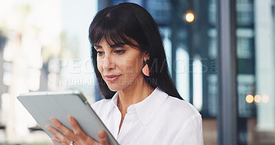 Buy stock photo Journalism, woman or reading with tablet at office, online article feedback or check story comments. Feature reviews, journalist or mature person with tech at workplace, publication site or news app