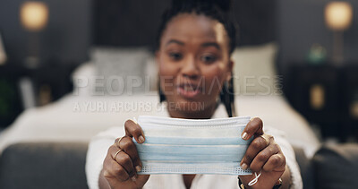 Buy stock photo Online, tutorial and hands with mask, bedroom and health demonstration for audience on social media. Influencer, live streaming POV and black person in home, portrait and teaching safety hack on vlog