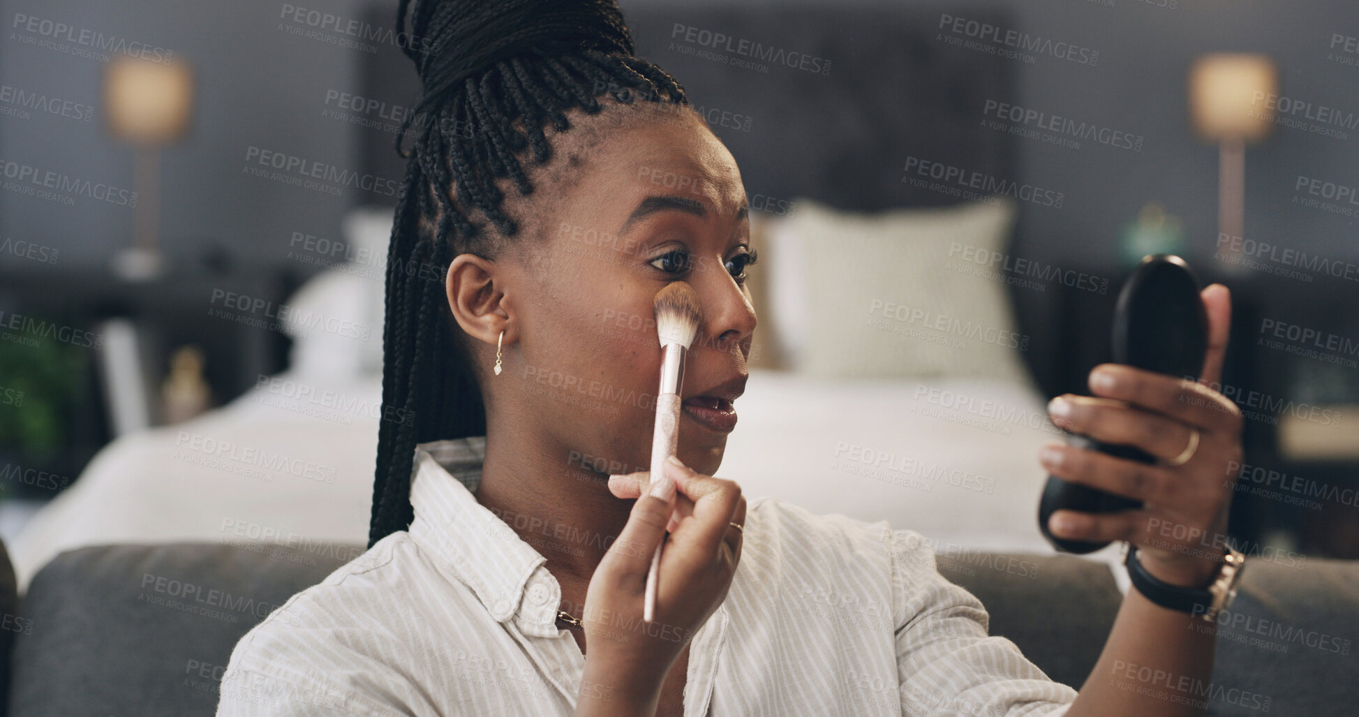 Buy stock photo Black woman, makeup and foundation with mirror or brush for cosmetics or beauty routine in home. Female person, skin contour or blush with reflection for eye shadow, shade or blending color in house