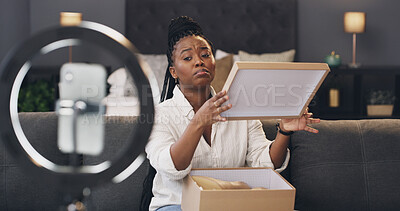 Buy stock photo Content creator, ring light and black woman with box in home for recording, unboxing or product review. Influencer, live streaming and person with omg, wow and reaction for package, parcel or opening