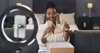 Buy stock photo Influencer, happy and black woman with shoes for live streaming, product review and unboxing. Content creator, social media and person in home with fashion opinion, feedback and talking on broadcast