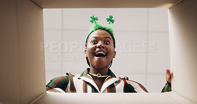 Buy stock photo Surprise, open box and pov of black woman with headband for present, gift and package for St Patricks day. Happy, below and portrait of person with parcel for shock, wow and excited for celebration