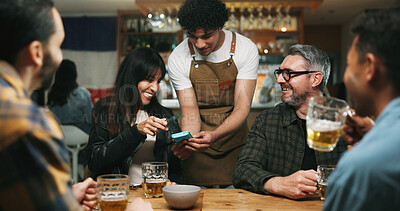 Buy stock photo Waiter, woman or phone with payment at pub for beer purchase, paperless transaction or drinking. Friends, people and server with POS machine in bar for NFC tap, drinks checkout and social gathering