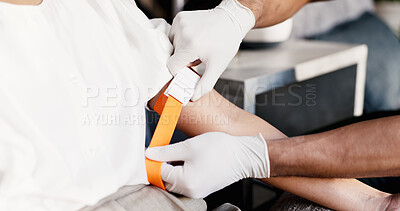 Buy stock photo Doctor, hands and IV drip with arm strap for medical injection or needle prep in clinic. Closeup, nurse or patient getting ready with healthcare for artery vein, vitamin infusion or immune booster
