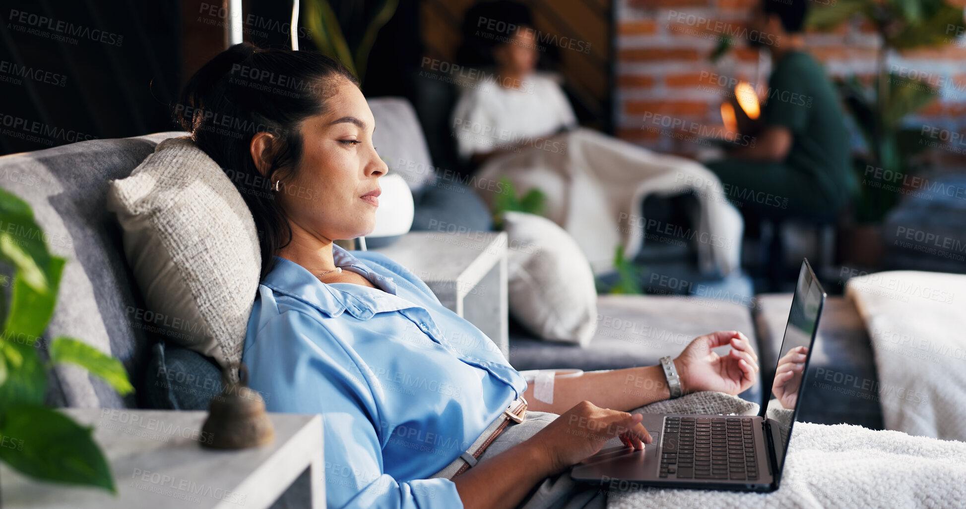 Buy stock photo Drip therapy, woman and laptop in lounge for immune health, online search and wellness benefits. People, patient and tech with IV fluid for mineral infusion, browsing website and hormonal imbalance