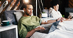 Man, relax and iv infusion with laptop for streaming movies, minerals and browsing website. Person, reading and pc with injection drip for nutrition treatment, social media and article for wellness