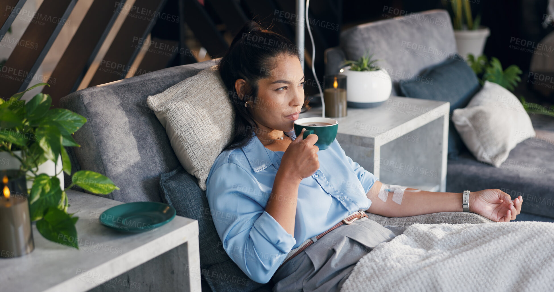 Buy stock photo Woman, relax and tea with IV drip for vitamins, nutrition or immune booster on bed in clinic. Female person, patient or drinking with herbal beverage or blood infusion for antioxidant or wellness