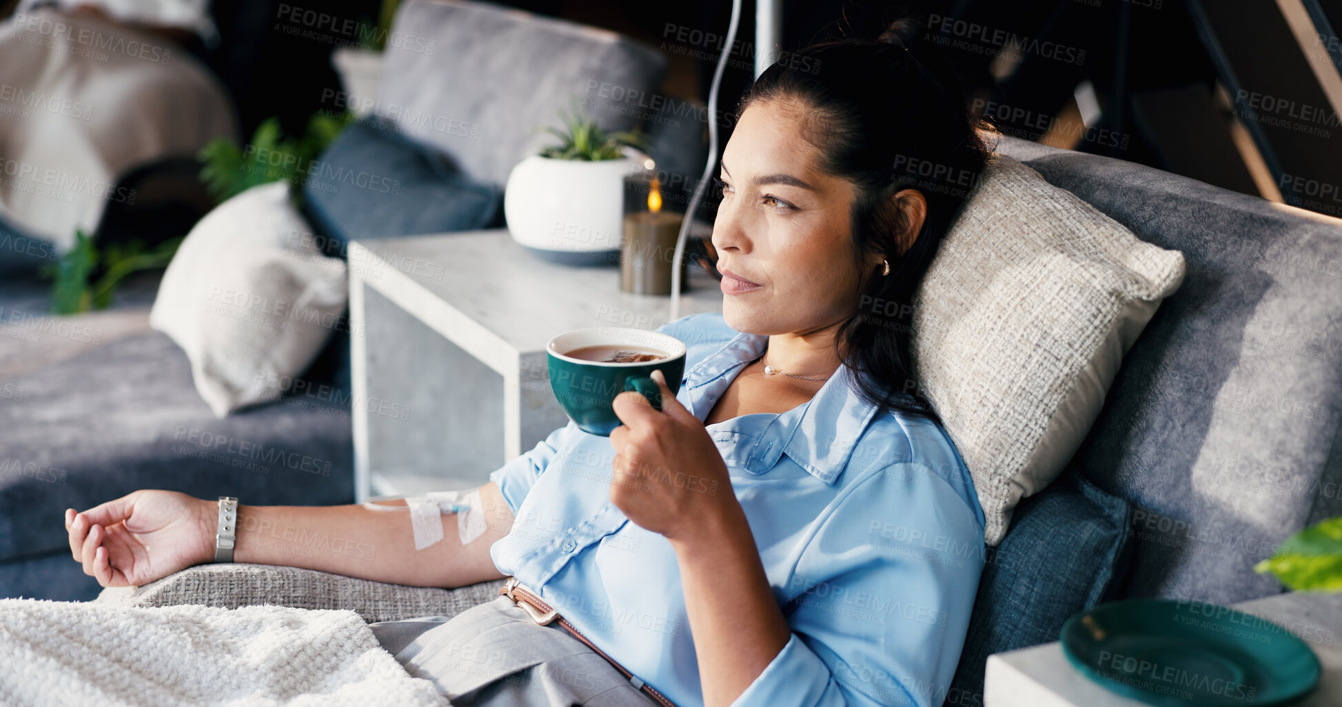 Buy stock photo Woman, relax and tea with IV drip for nutrition, immune booster or vitamins on bed in clinic. Female person, patient or drinking with herbal beverage or blood infusion for antioxidant or wellness