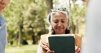 Buy stock photo Mature woman, volunteer and tablet outdoor for charity, online checklist and community service. Group, people and digital for donation inventory, humanitarian outreach and reading schedule for event