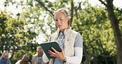 Buy stock photo Woman, volunteer and confused with tablet at park for charity, checklist error and community service. Below, person and digital for inventory mistake, donation shortage and distribution delay for aid